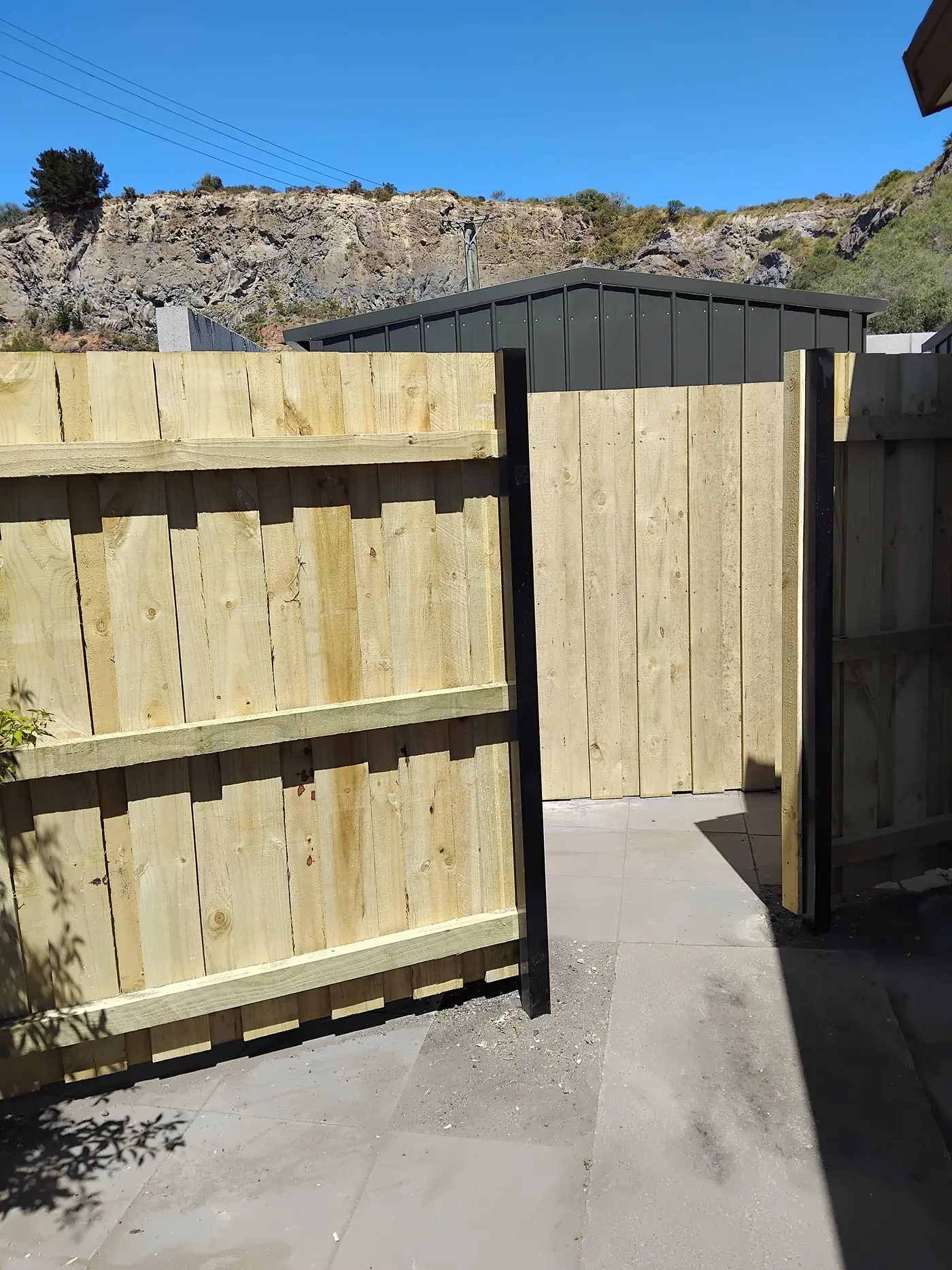 Shiplap fence with a steel-framed timber-clad gate