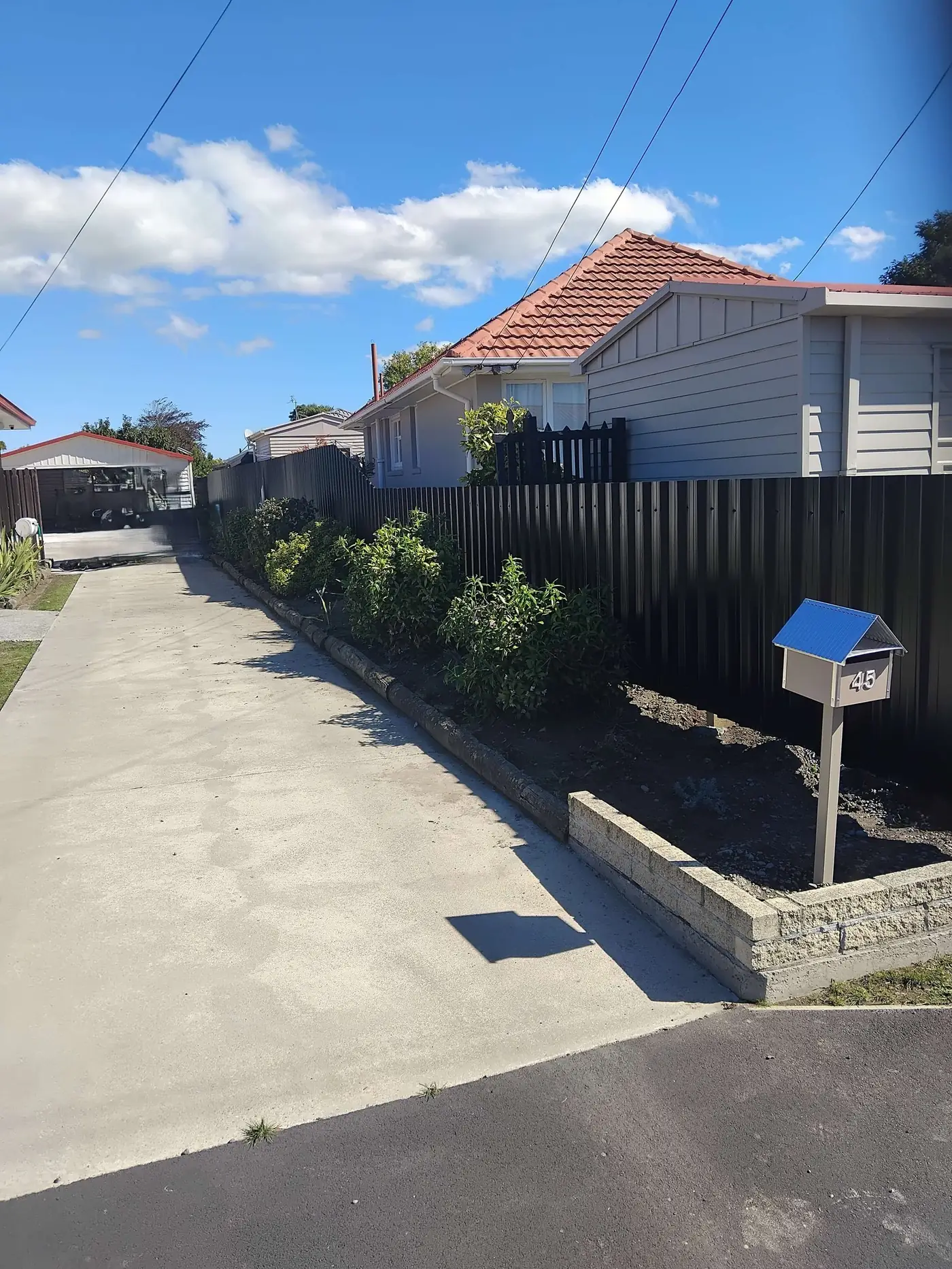 Black Colourbond privacy fence, 5-ridge steel panels, Bishopdale, Christchurch