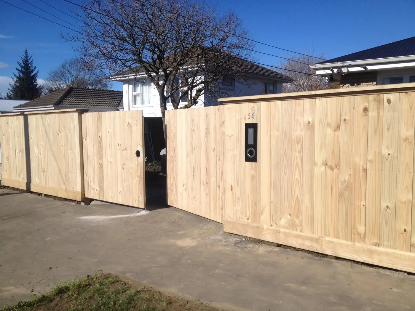 Premium natural timber fence with dark frame posts, built in Christchurch
